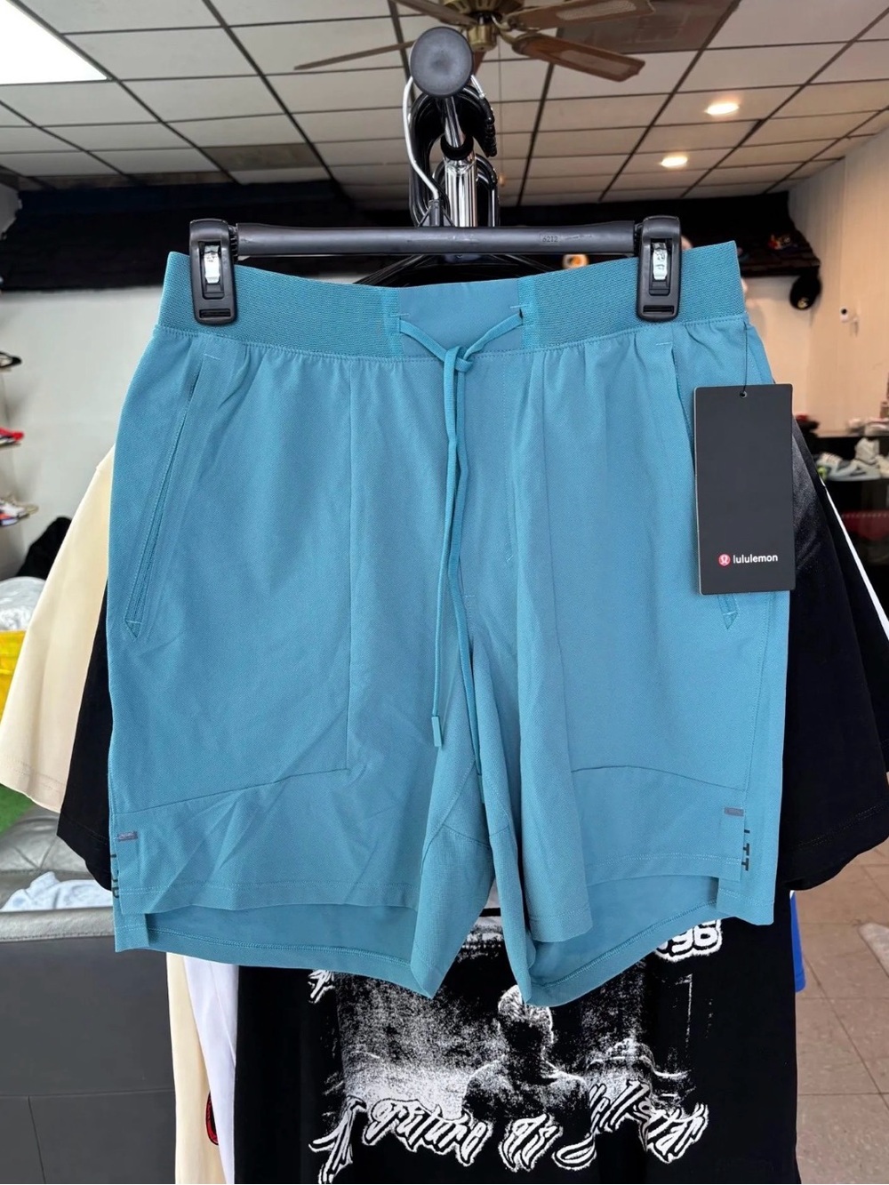 Lululemon License to Train Shorts in an oceanic teal green color size M